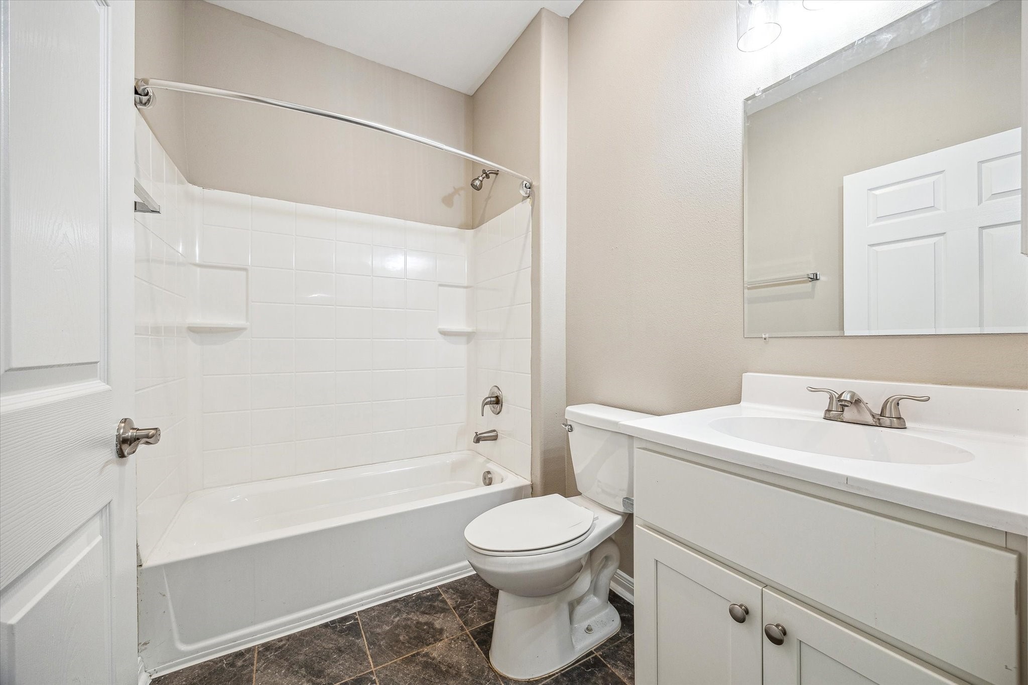 201 Smiley Road Angleton, TX 77515 - Photo 7 of 10 a bathroom with a sink a toilet and a mirror
