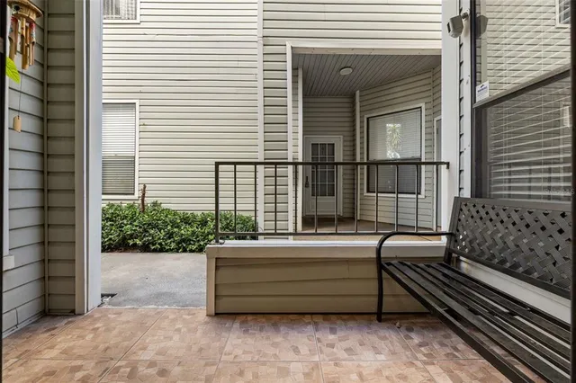 a view of a roof deck with furniture