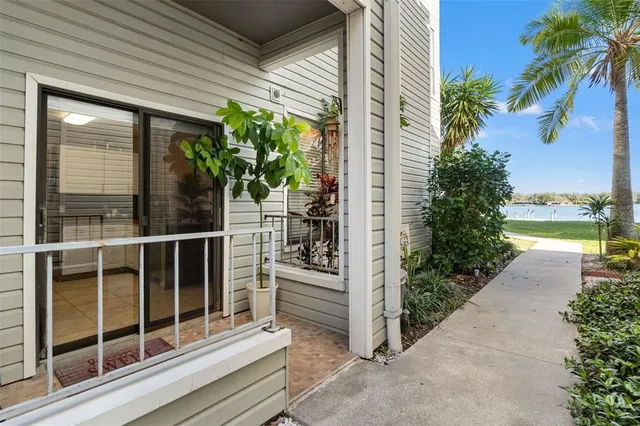 a view of a balcony with potted plants