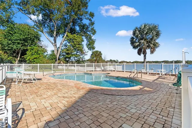 a view of a swimming pool with a house