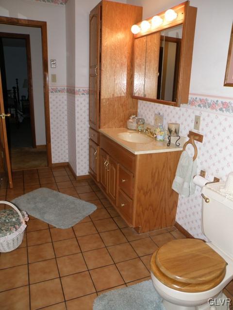 145 Hawk Road Lehighton, PA 18235 - Photo 30 of 50 a bathroom with a granite countertop sink and a mirror
