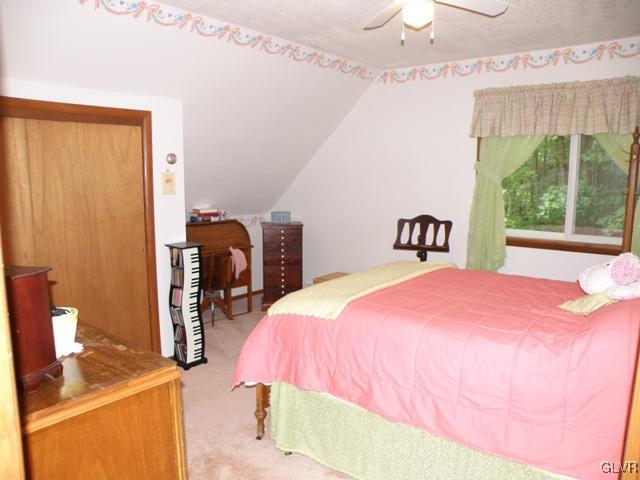 145 Hawk Road Lehighton, PA 18235 - Photo 33 of 50 a bedroom with a bed and a table
