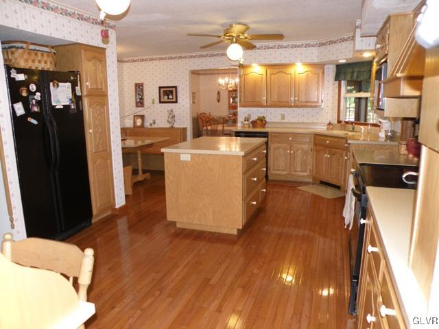 145 Hawk Road Lehighton, PA 18235 - Photo 4 of 50 a large kitchen with cabinets a sink and a refrigerator