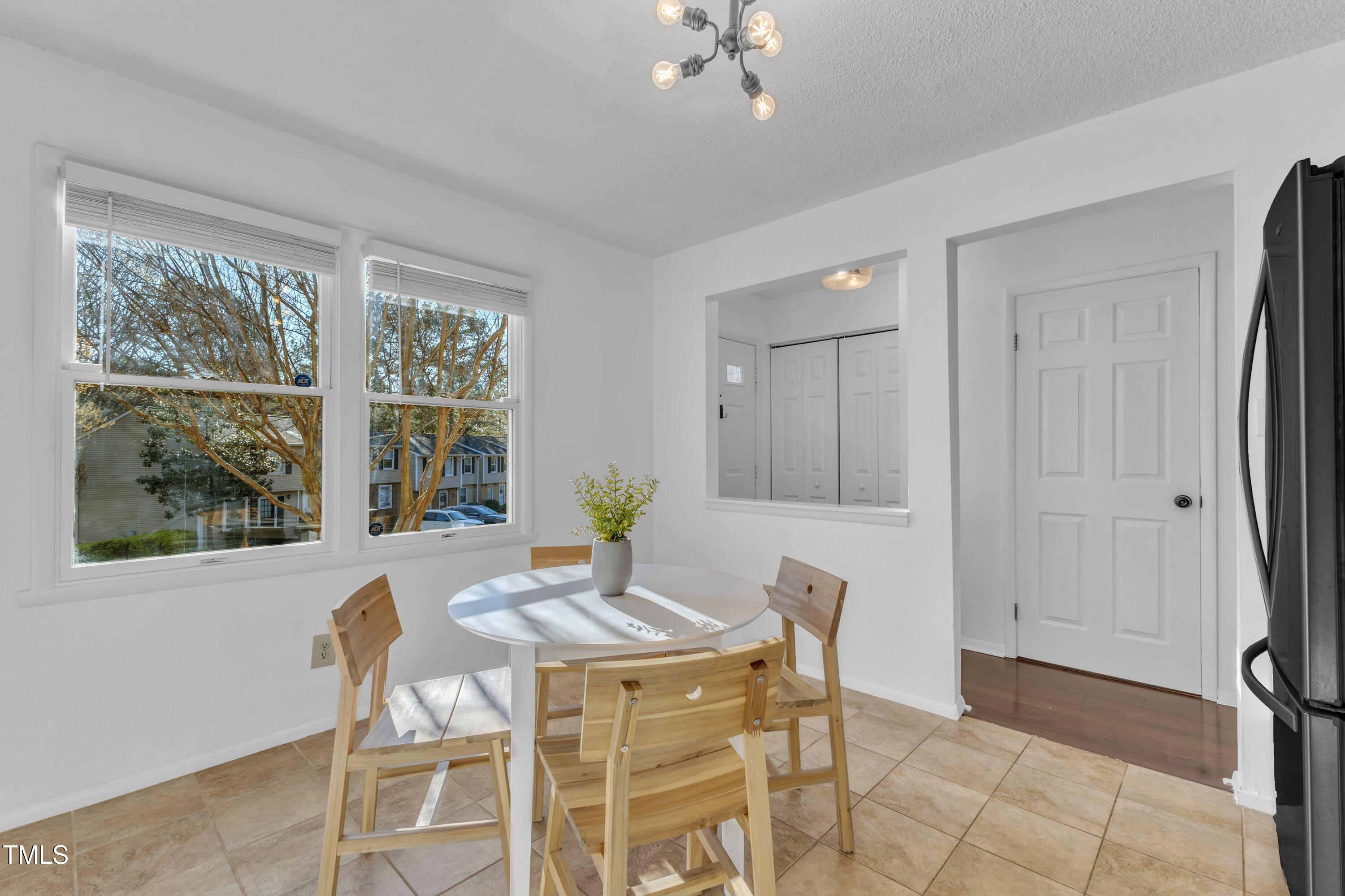 7727 Ohmann Court Raleigh, NC 27615 - Photo 7 of 40 a view of a dining room with furniture and window