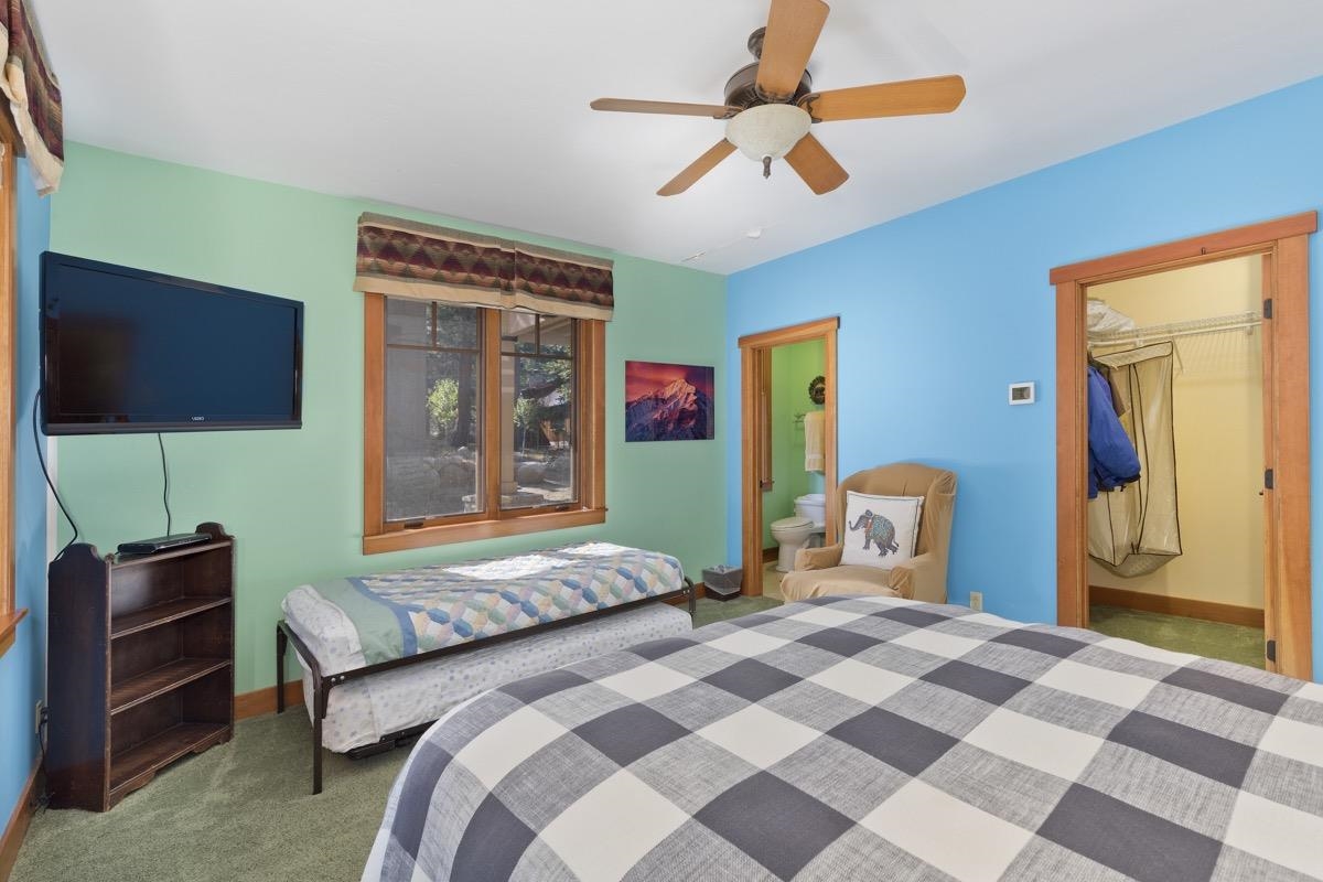 2500 Old Mammoth Road Mammoth Lakes, CA 93546 - Photo 35 of 48 a bedroom with a bed and a flat screen tv