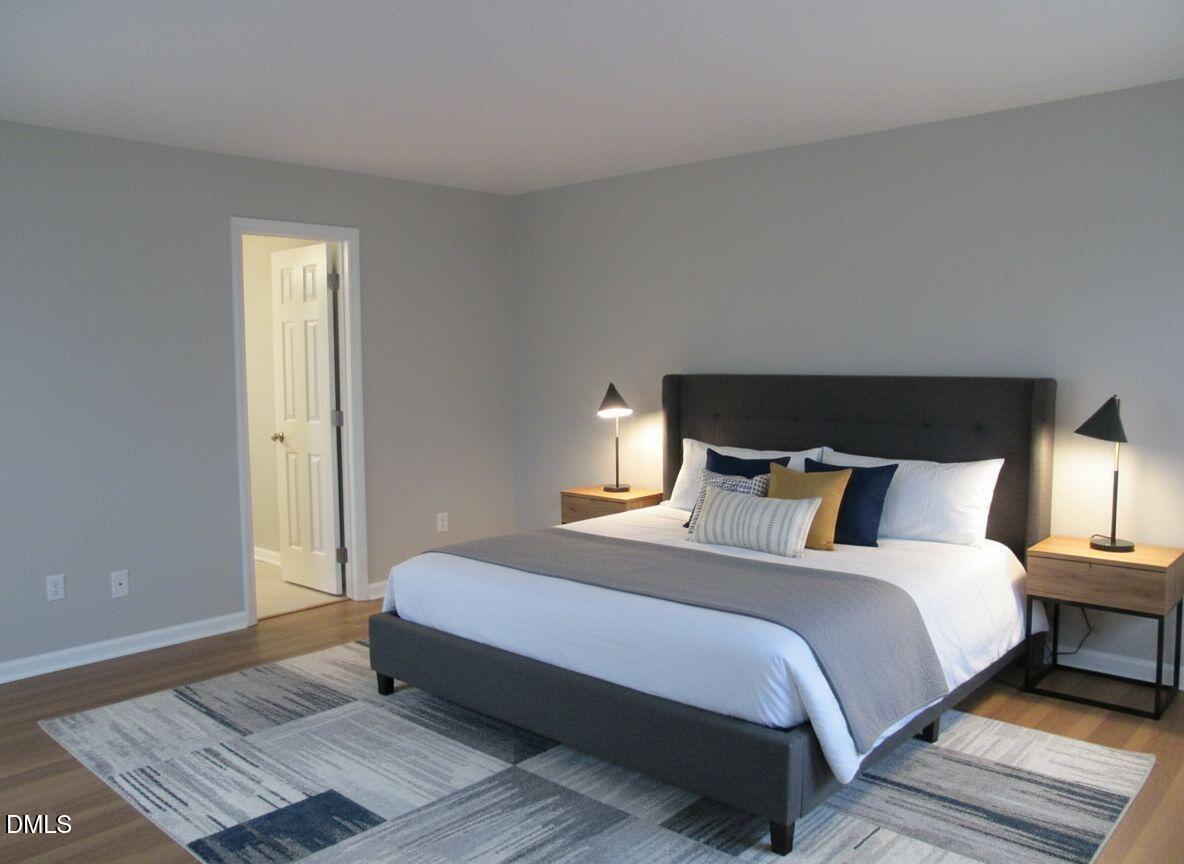 4651 Timbermill Court, Unit 103 Raleigh, NC 27612 - Photo 15 of 24 primary bedroom