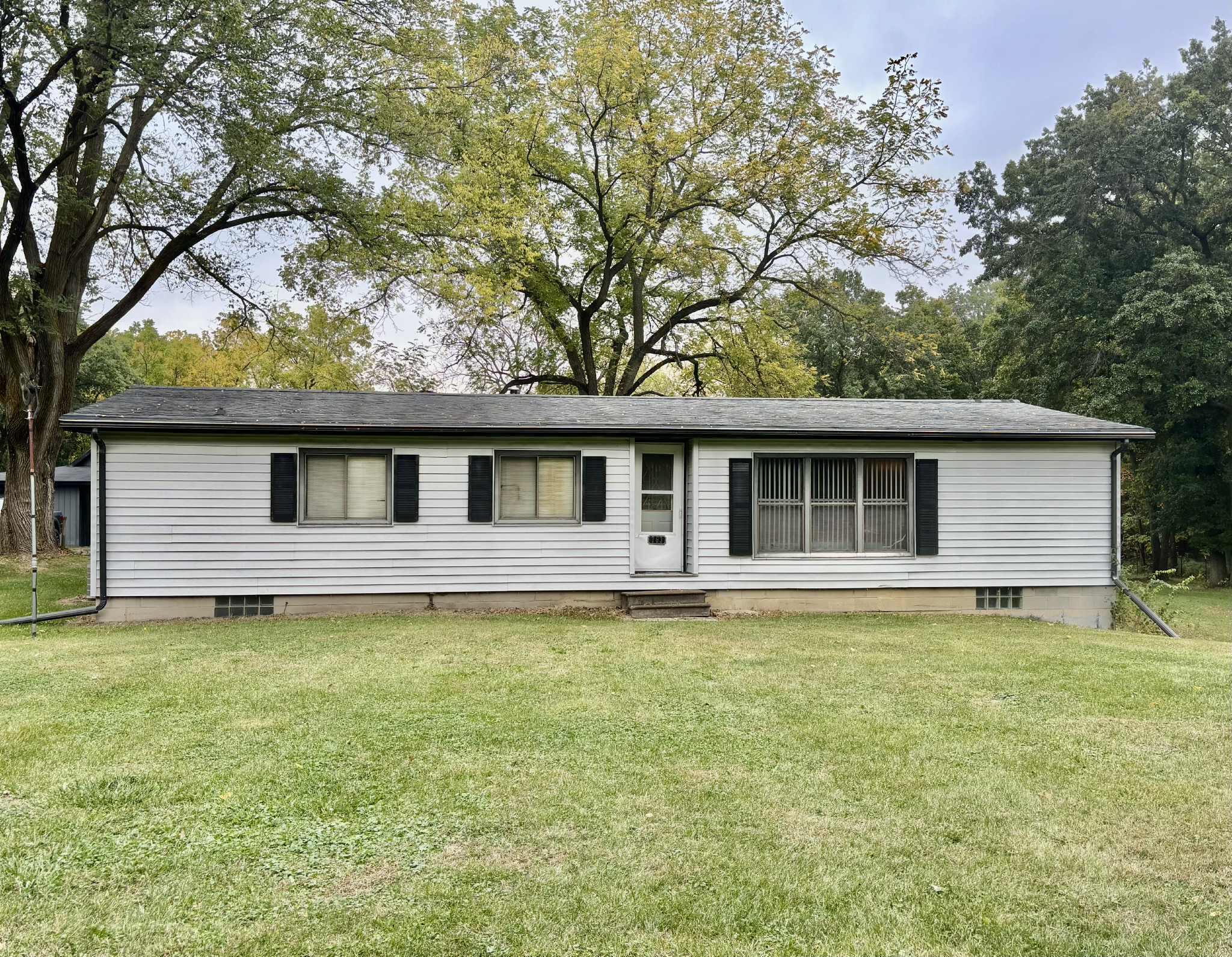 front view of a house with a yard