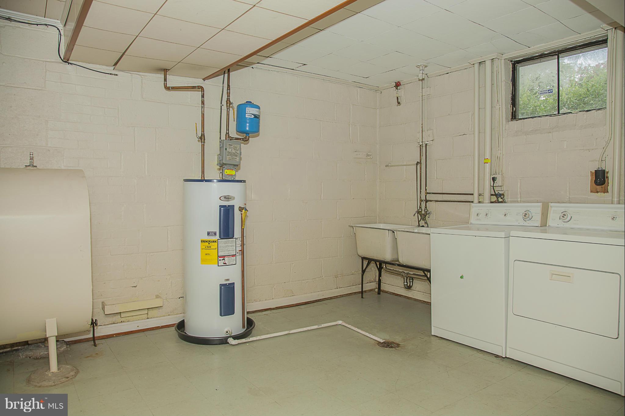 10309 Parkman Road Silver Spring, MD 20903 - Photo 22 of 28 a view of a storage & utility room with a sink