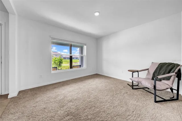 a kitchen with a table and chairs in it
