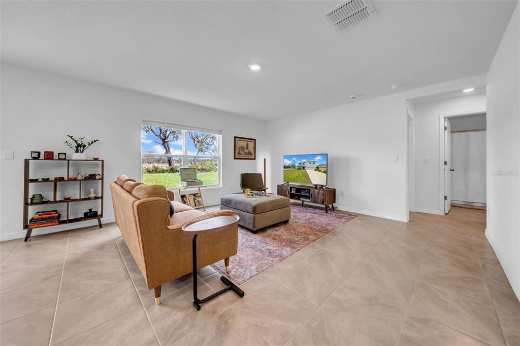 13295 Mylion Way, Unit 1 Spring Hill, FL 34610 - Photo 15 of 59 a living room with furniture and a window