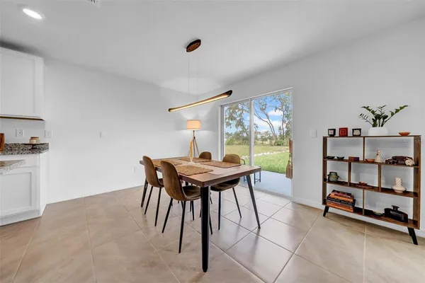 an empty room with windows and wall painting