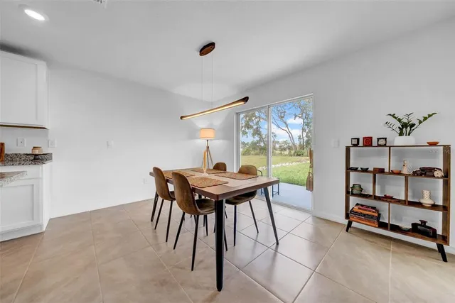 an empty room with windows and wall painting