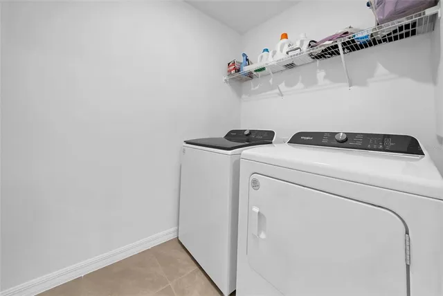 an empty room with windows and garden view