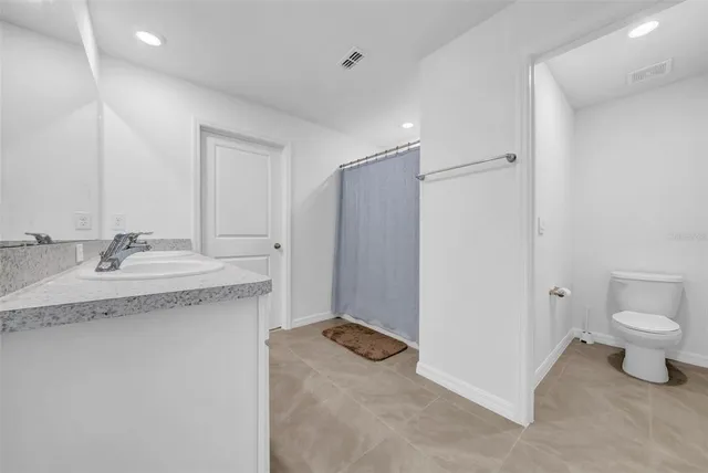 a bedroom with a bed and a table in it