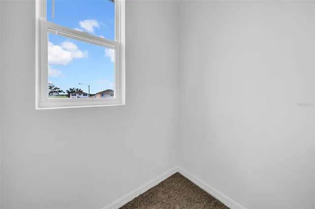 a bedroom with a bed and a night stand