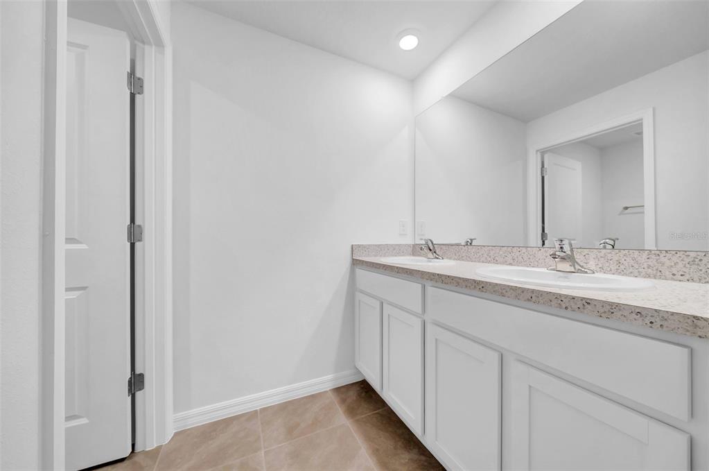 13295 Mylion Way, Unit 1 Spring Hill, FL 34610 - Photo 44 of 59 a bathroom with a sink and a mirror