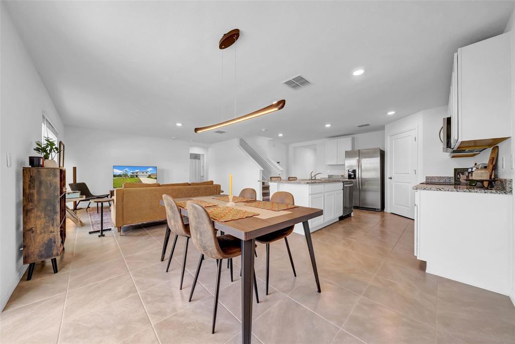 13295 Mylion Way, Unit 1 Spring Hill, FL 34610 - Photo 5 of 59 a kitchen with a table and chairs in it