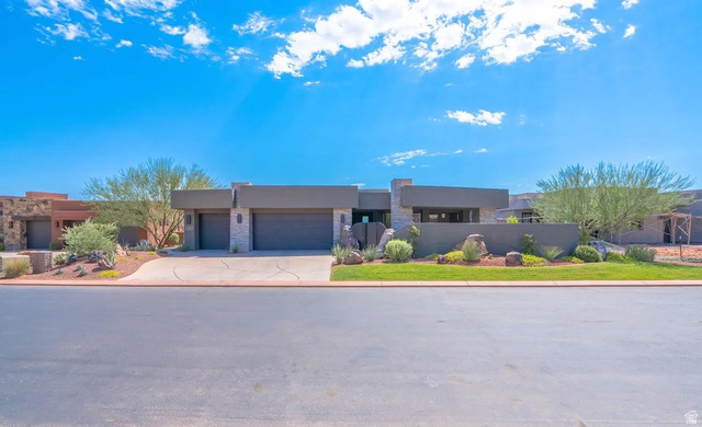 1500 Split Rock, Unit 150 Ivins, UT 84738 - Photo 1 of 18 Contemporary exterior with a flat roofline, stone accents, and a dual garage