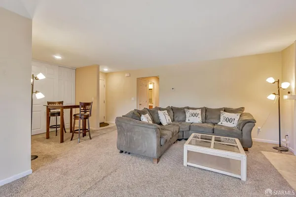 a living room with furniture and a table