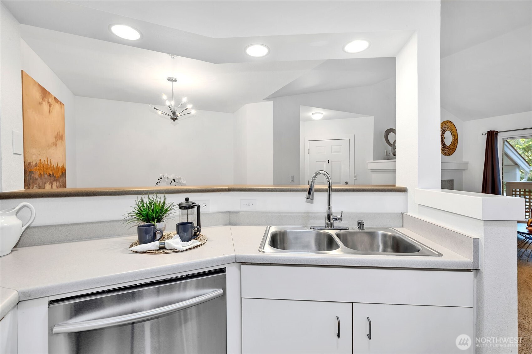 15300 112th Avenue Northeast, Unit C307 Bothell, WA 98011 - Photo 16 of 29 a kitchen with a sink and a potted plant