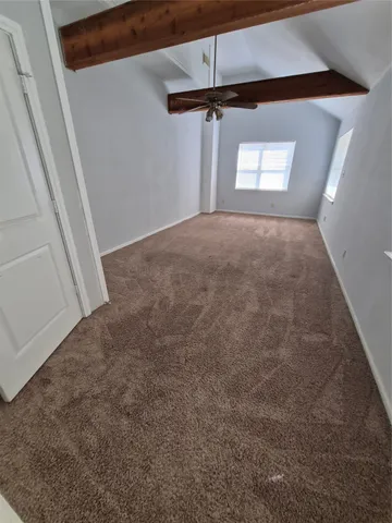 a view of empty room with windows