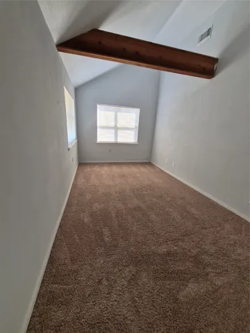 a view of a hallway to rooms and stairs