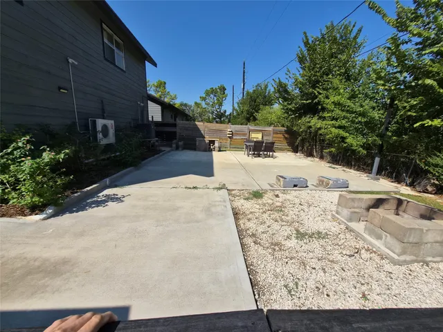 a view of a backyard of the house