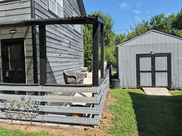 a view of house with backyard outdoor seating and plants