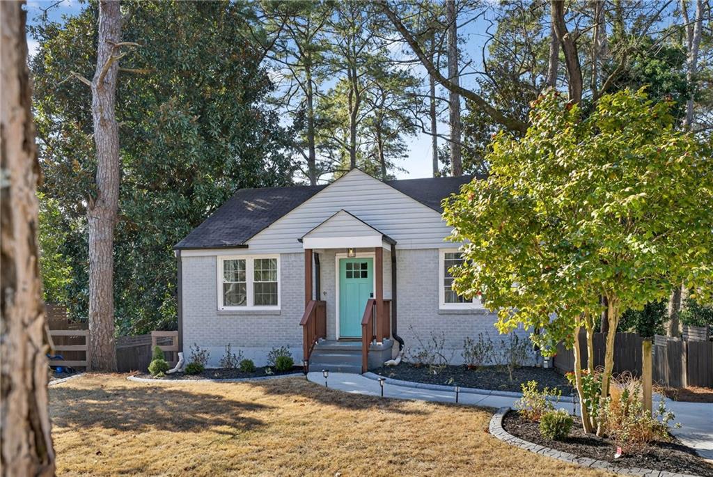 a front view of a house with garden