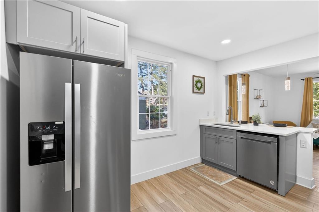 1939 Brannen Road Southeast Atlanta, GA 30316 - Photo 11 of 30 a kitchen with stainless steel appliances granite countertop a refrigerator and a sink