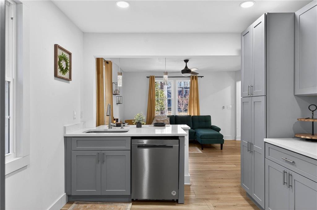 1939 Brannen Road Southeast Atlanta, GA 30316 - Photo 13 of 30 a kitchen with a sink stove and cabinets