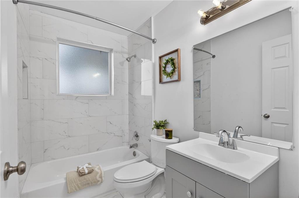 1939 Brannen Road Southeast Atlanta, GA 30316 - Photo 20 of 30 a bathroom with a sink toilet and shower