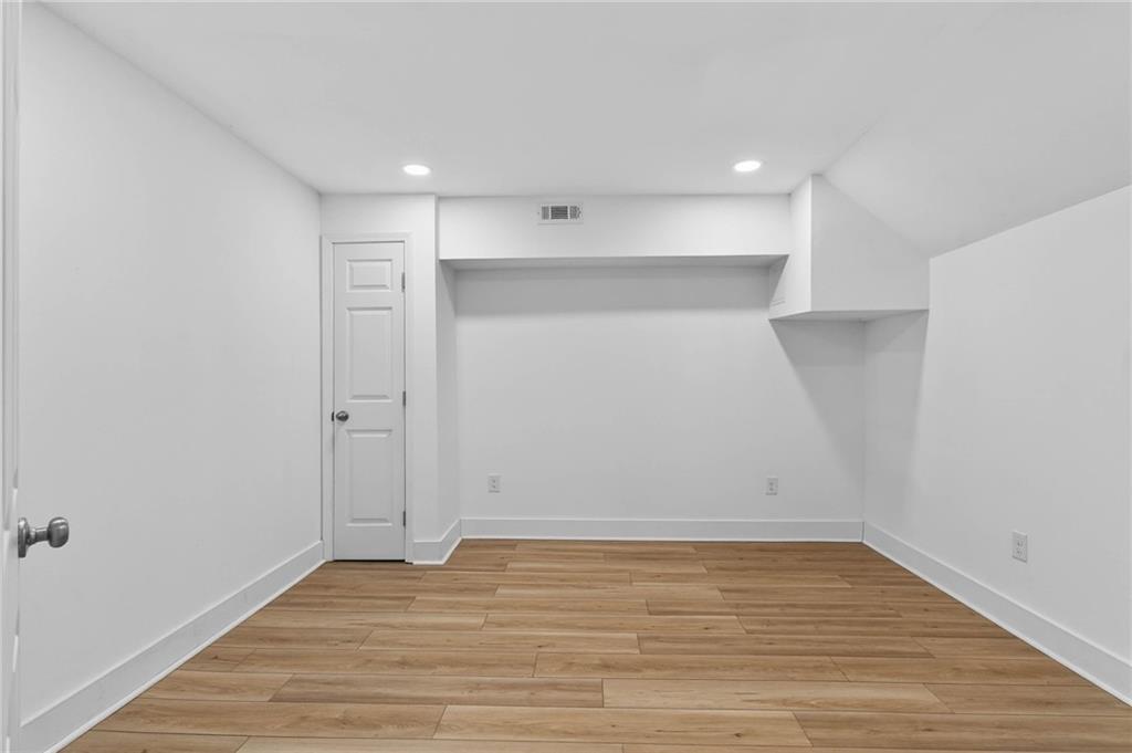 1939 Brannen Road Southeast Atlanta, GA 30316 - Photo 21 of 30 a view of an empty room with wooden floor