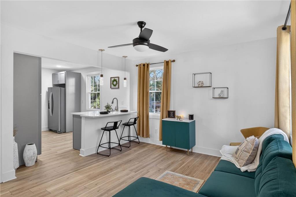 1939 Brannen Road Southeast Atlanta, GA 30316 - Photo 6 of 30 a living room with furniture and a wooden floor