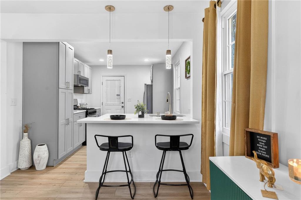 1939 Brannen Road Southeast Atlanta, GA 30316 - Photo 8 of 30 a large kitchen with a table and chairs