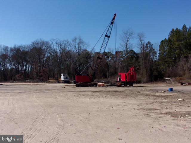 313 Tansboro Road Berlin, NJ 08009 - Photo 6 of 11 a view of a road with a small yard