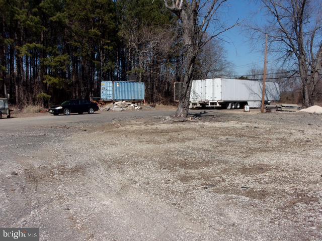 313 Tansboro Road Berlin, NJ 08009 - Photo 7 of 11 a view of a house with a yard covered in snow
