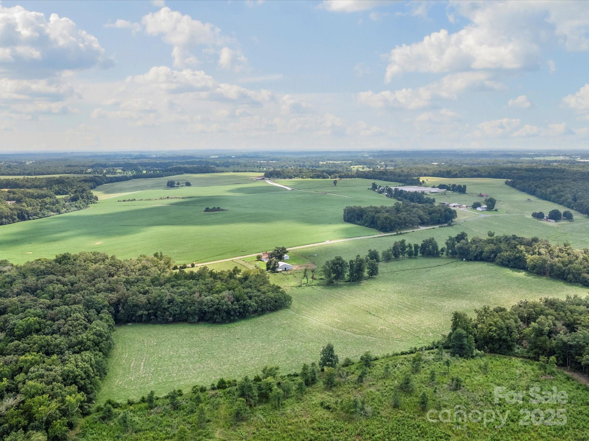0 Thanny Helms Road Peachland, NC 28133 - Photo 11 of 12 an aerial view of a houses with outdoor space and trees all around