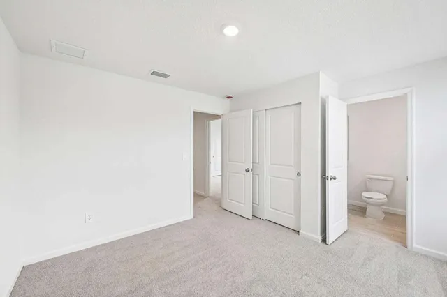 a view of room with bathroom and a toilet