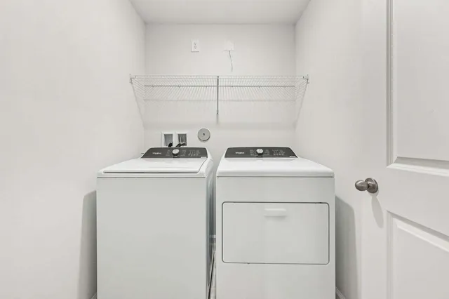 a utility room with dryer and washer