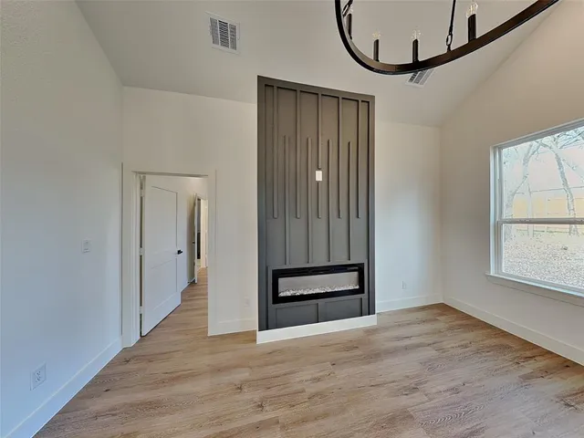 a view of an entryway with wooden floor