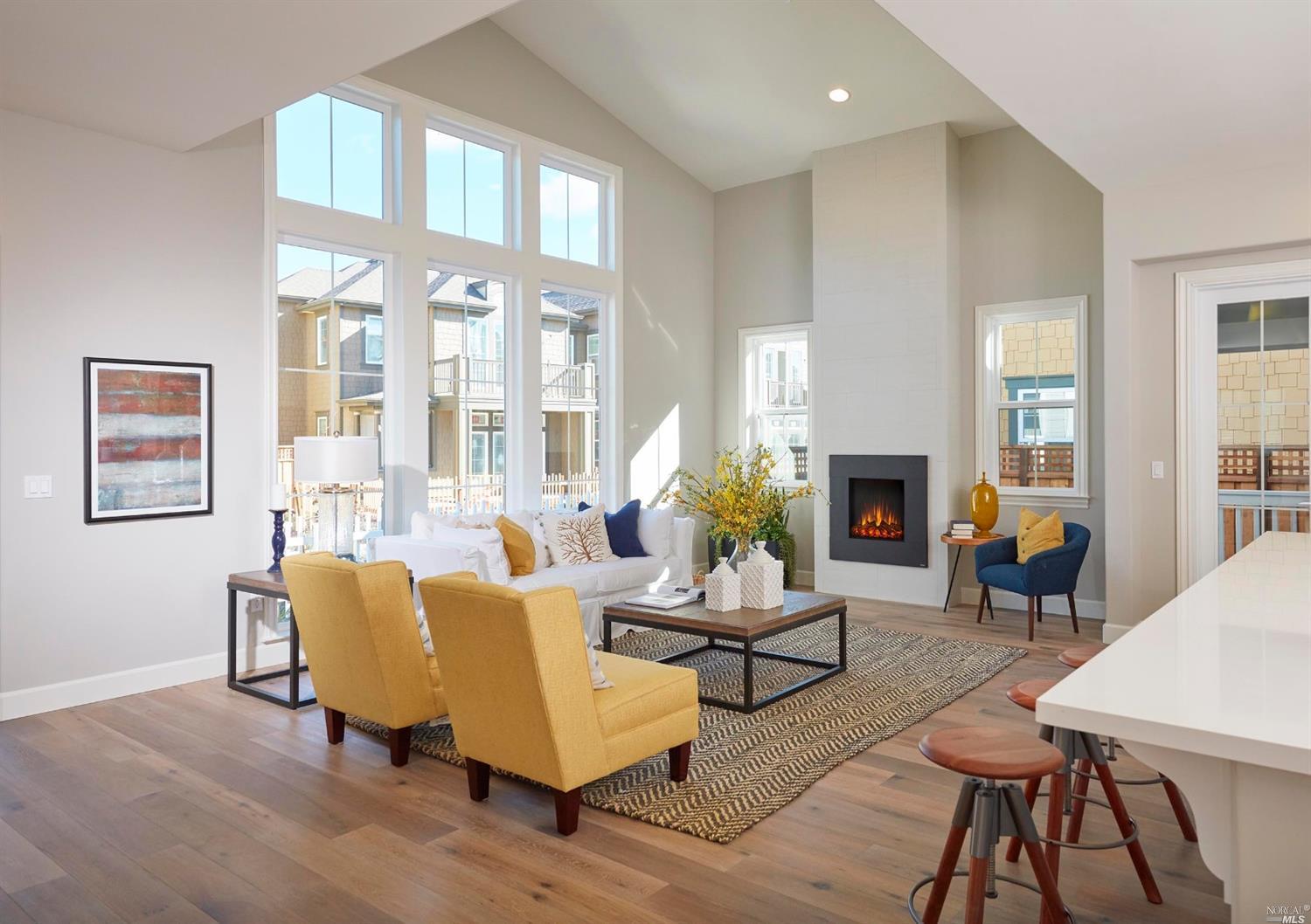 a living room with furniture a fireplace and a table