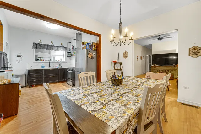 a kitchen with stainless steel appliances and a refrigerator