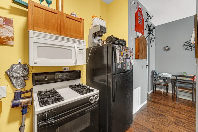 a bedroom with furniture and a baby crib