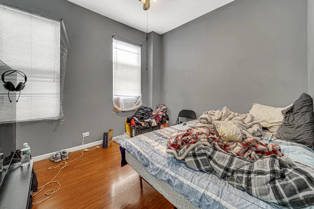 a living room with furniture a rug and a large window