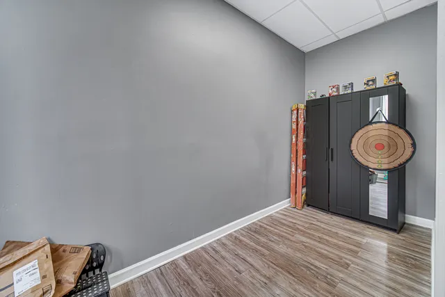 a view of a storage & utility room with wooden floor