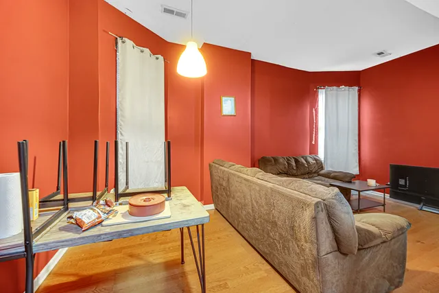 a kitchen with a refrigerator and a stove top oven