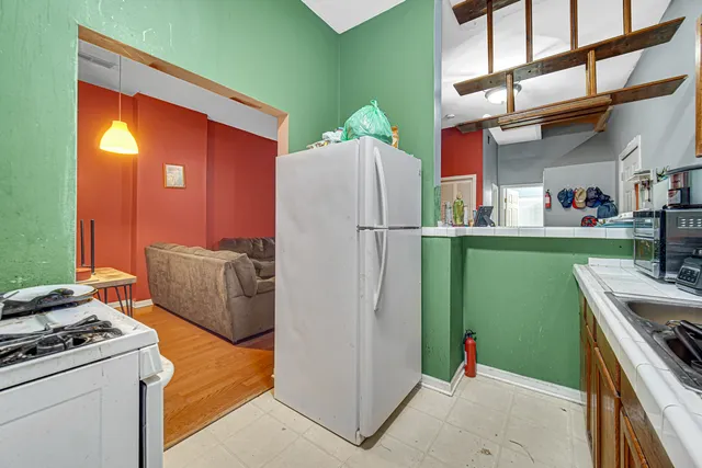 a bathroom with a toilet a sink and a shower curtain