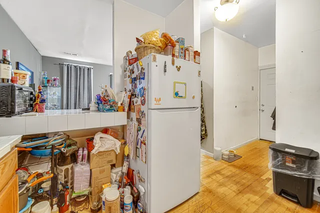 a bed room with furniture and a flat screen tv