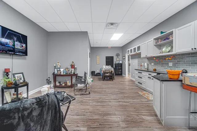 a living room with furniture and a flat screen tv